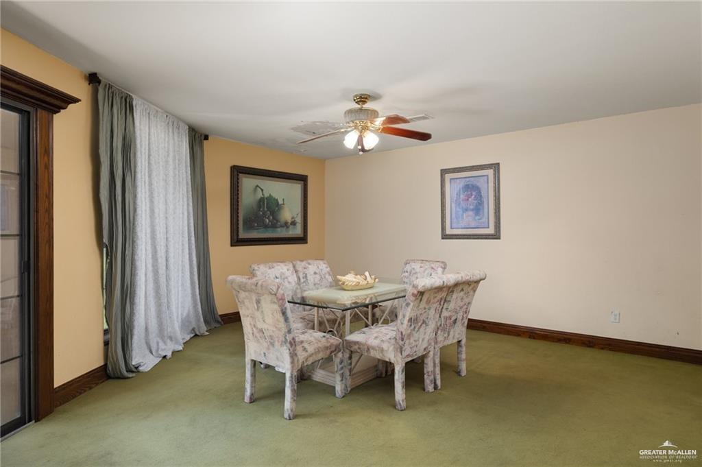 4523 South Tower Road Edinburg, TX 78542 - Photo 16 of 34 a dining room with furniture and window