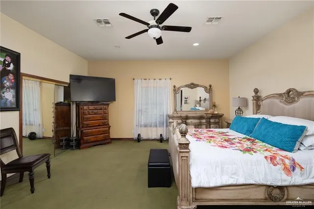 a bedroom with bed and balcony