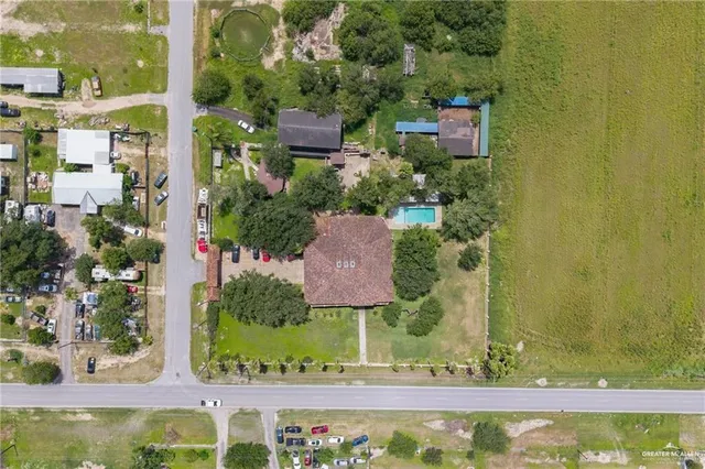 an aerial view of residential building and lake