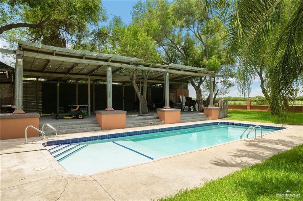 4523 South Tower Road Edinburg, TX 78542 - Photo 5 of 34 a view of a house with swimming pool and a yard