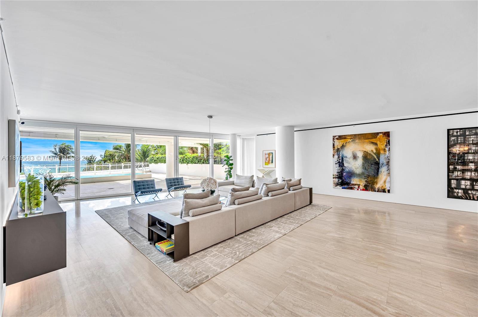 9001 Collins Avenue, Unit S201 Surfside, FL 33154 - Photo 11 of 44 a living room with furniture and a large window