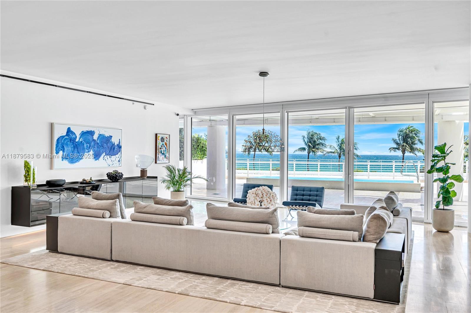 9001 Collins Avenue, Unit S201 Surfside, FL 33154 - Photo 12 of 44 a living room with furniture and a large window