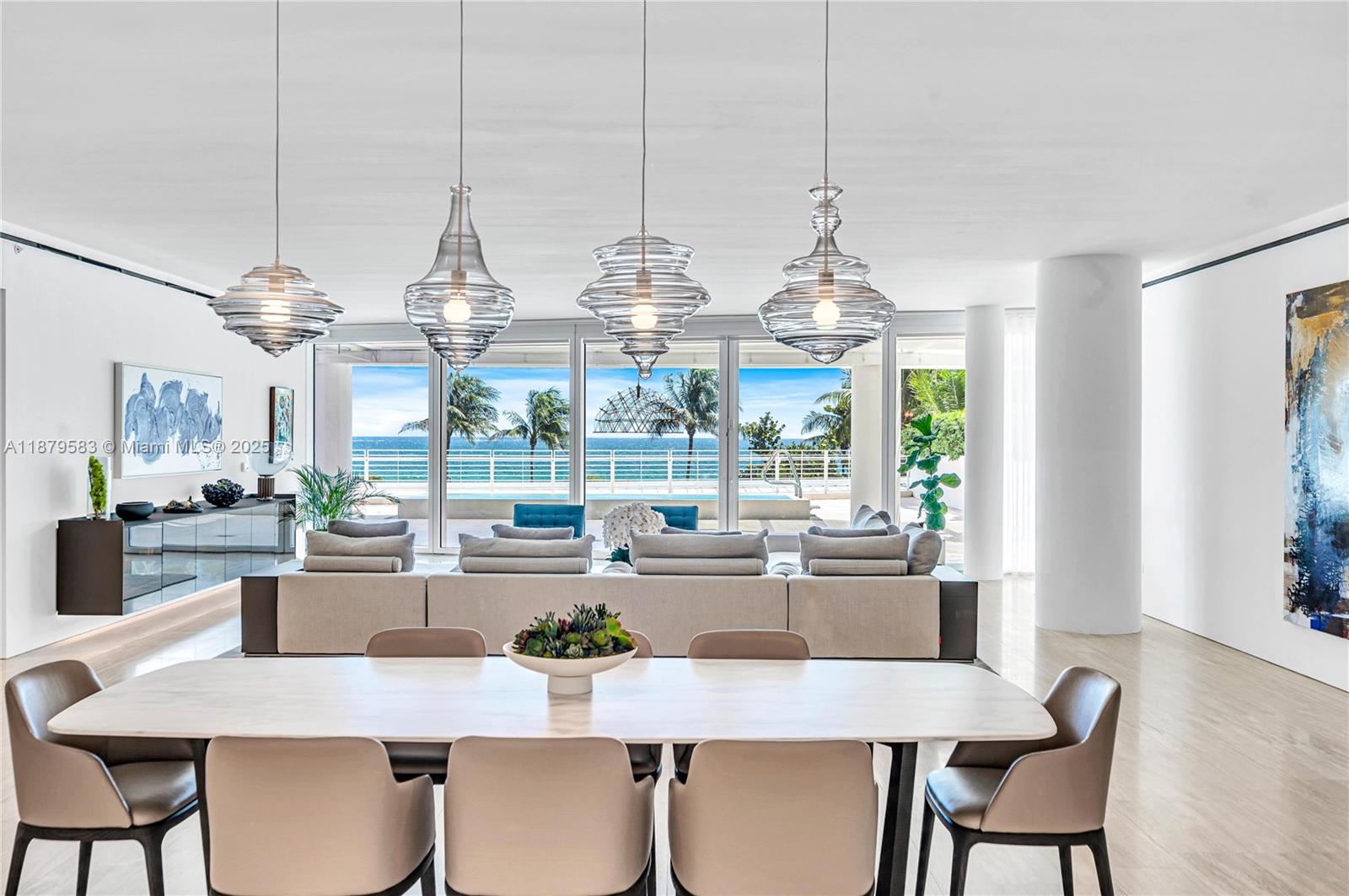 9001 Collins Avenue, Unit S201 Surfside, FL 33154 - Photo 16 of 44 a dining room filled with furniture and window