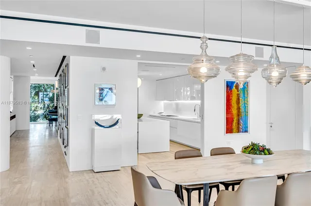 a kitchen with a table and chairs in it