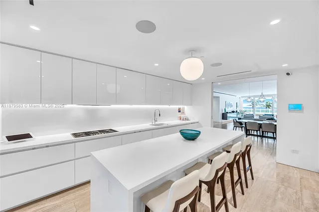 a kitchen with a table and chairs in it
