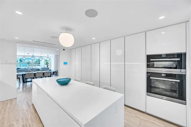 a kitchen with a table and chairs