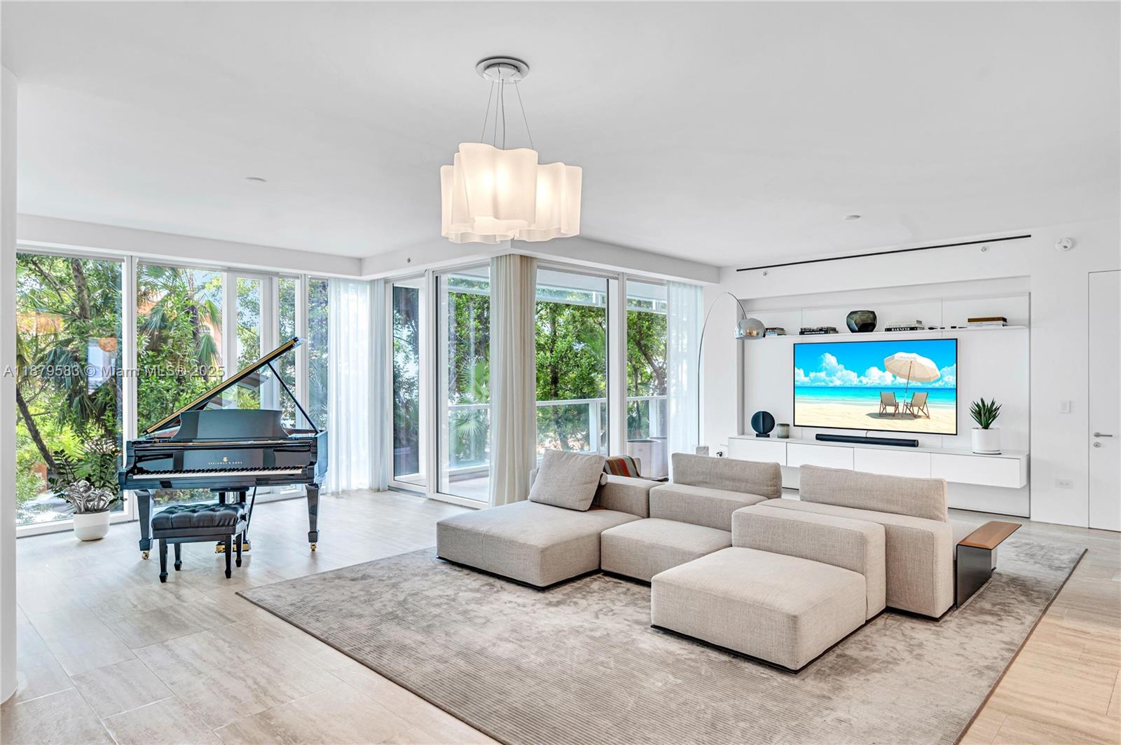 9001 Collins Avenue, Unit S201 Surfside, FL 33154 - Photo 25 of 44 a living room with furniture a floor to ceiling window and wooden floor