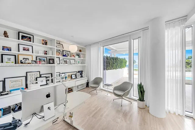 a room with furniture cabinets and a window