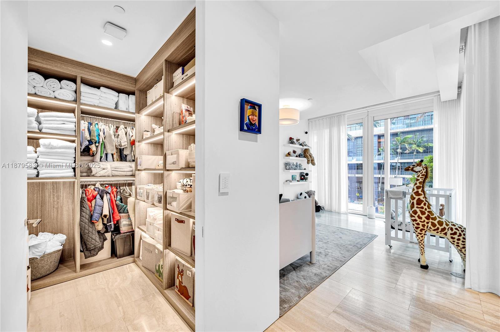 9001 Collins Avenue, Unit S201 Surfside, FL 33154 - Photo 38 of 44 a view of a livingroom with lots of stuff and hardwood floor