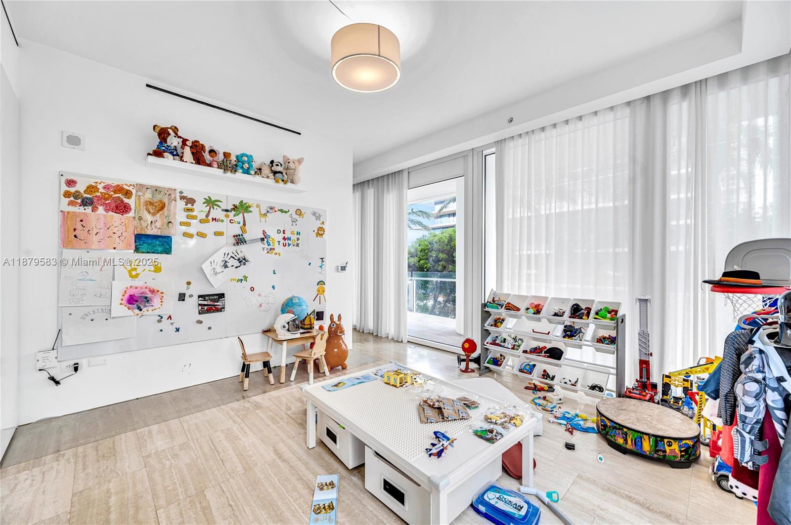 9001 Collins Avenue, Unit S201 Surfside, FL 33154 - Photo 40 of 44 a bedroom with furniture a bed and a window