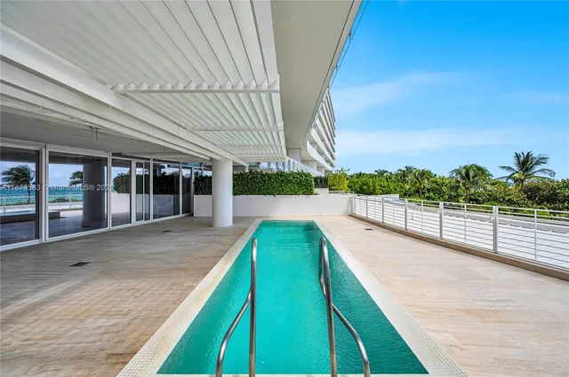 a view of swimming pool with a patio