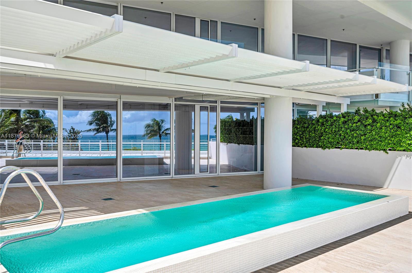 9001 Collins Avenue, Unit S201 Surfside, FL 33154 - Photo 5 of 44 a view of an house with backyard porch and furniture