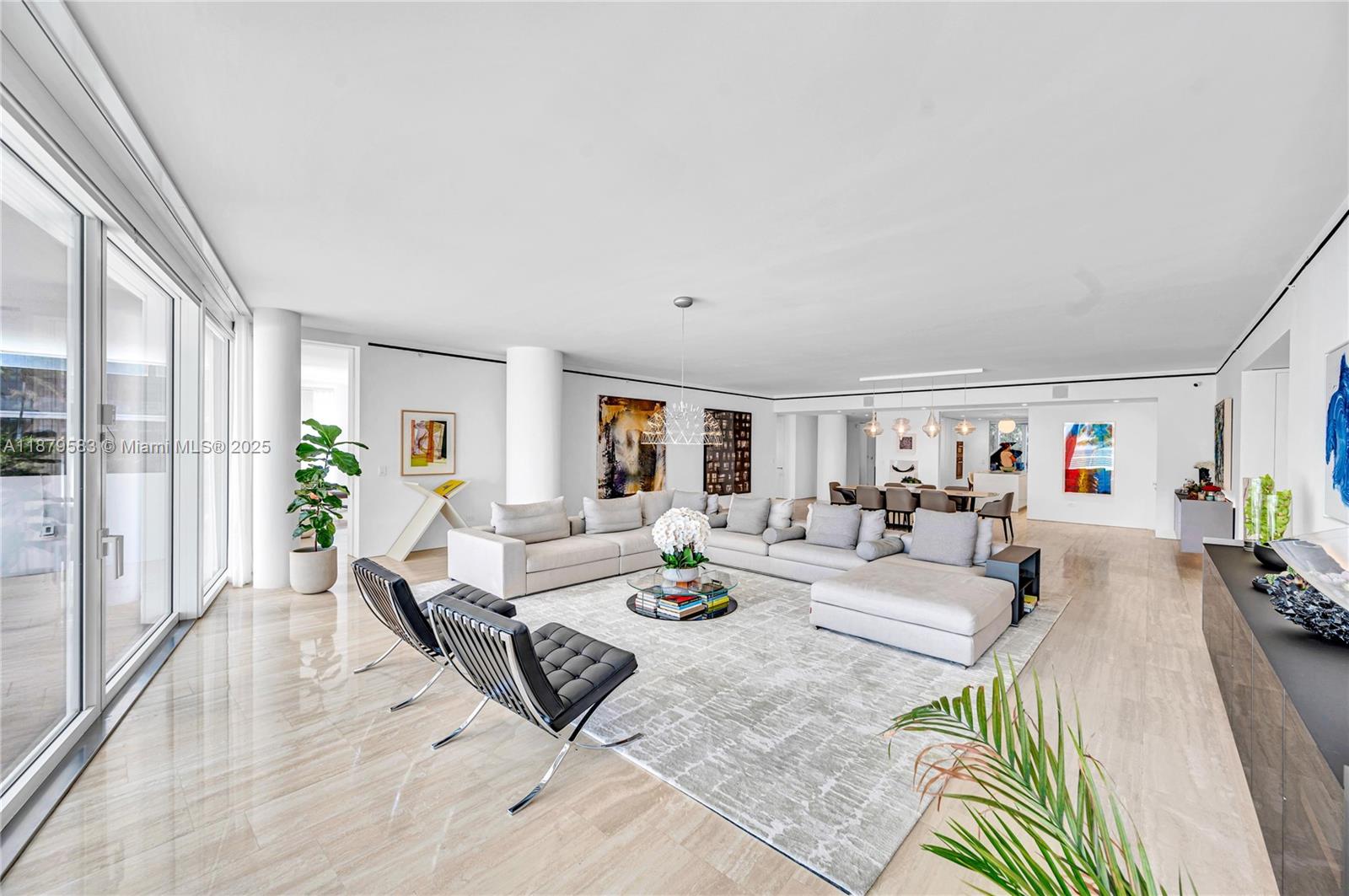 9001 Collins Avenue, Unit S201 Surfside, FL 33154 - Photo 7 of 44 a living room with furniture and a wooden floor