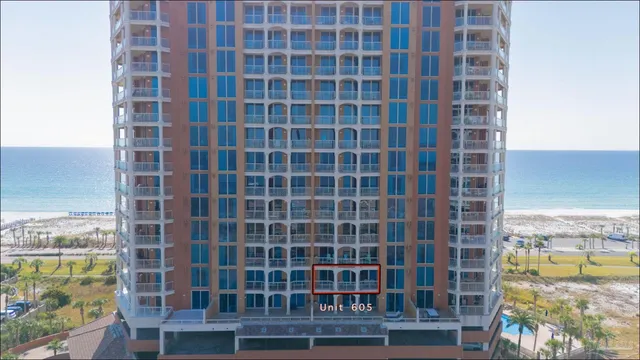 a view of a balcony with wooden floor and a city view