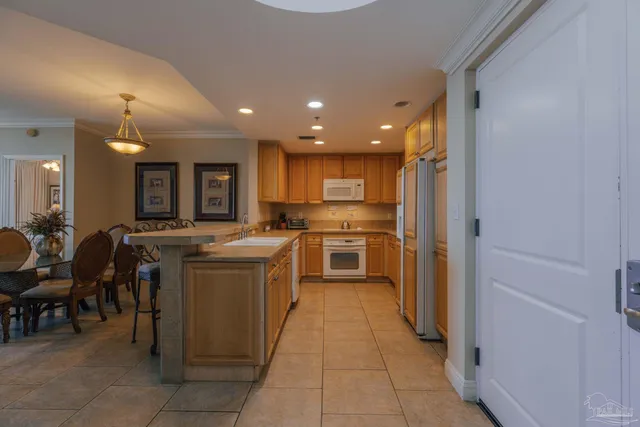 a kitchen with a sink and refrigerator