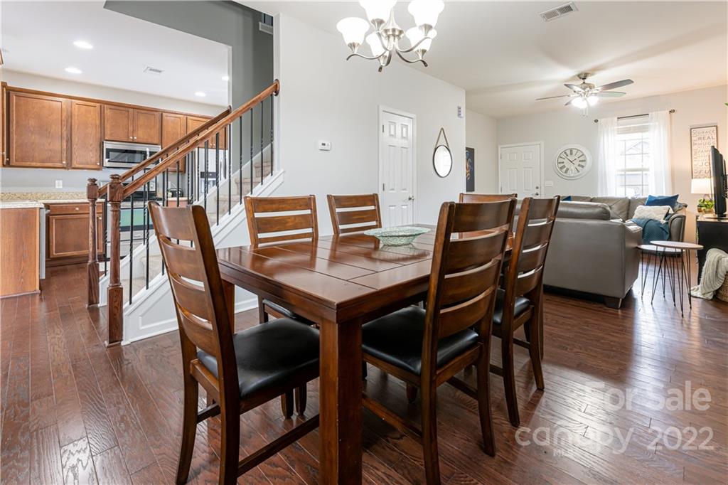 105 North River Road Fletcher, NC 28732 - Photo 13 of 43 a view of a dining room with furniture wooden floor and chandelier