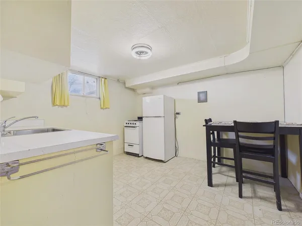 a utility room with cabinets washer and dryer