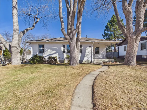 a front view of house with yard and seating area