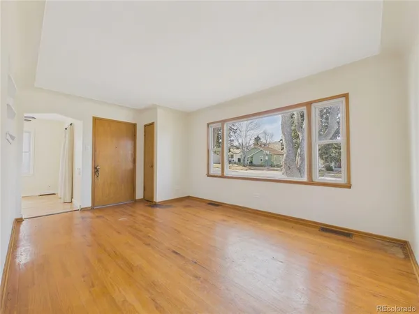 a view of an empty room with a window