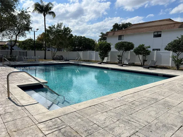 a view of swimming pool with a patio