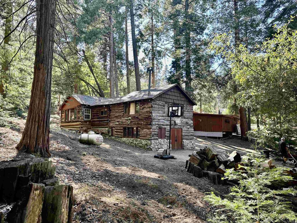 22194 Crestline Road Palomar Mountain, CA 92060 - Photo 3 of 75 a view of a chairs and table in the back yard