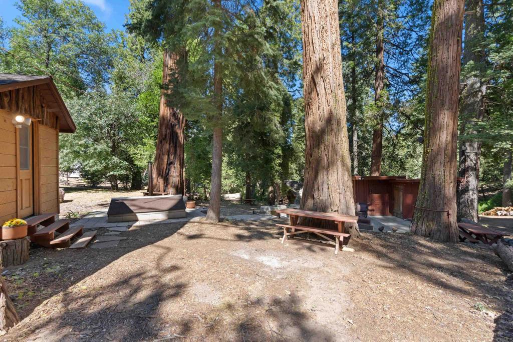 22194 Crestline Road Palomar Mountain, CA 92060 - Photo 33 of 75 To the right of the Honeymoon Cabin is a roof that can be lifted off a wood-fired, cement jacuzzi.