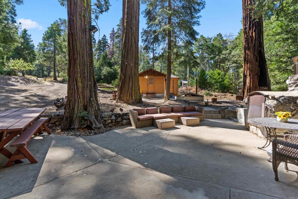 22194 Crestline Road Palomar Mountain, CA 92060 - Photo 40 of 75 a view of a patio with swimming pool table and chairs