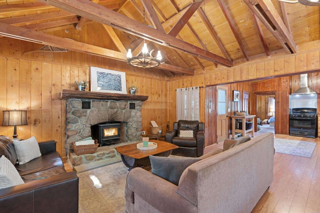 22194 Crestline Road Palomar Mountain, CA 92060 - Photo 4 of 75 a living room with furniture and a fireplace