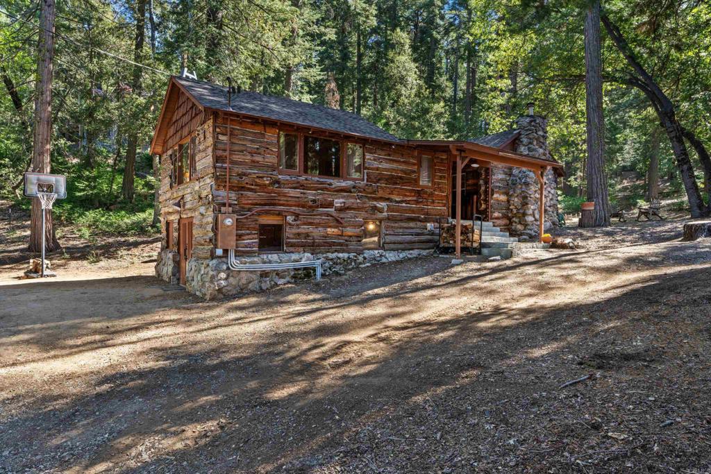 22194 Crestline Road Palomar Mountain, CA 92060 - Photo 7 of 75 a view of a house with backyard and trees