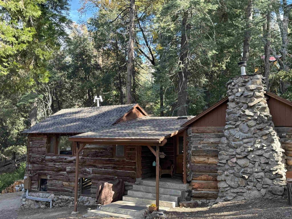 22194 Crestline Road Palomar Mountain, CA 92060 - Photo 71 of 75 a front view of a house with garage
