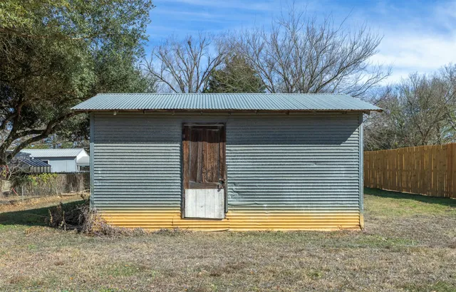 a view of a patio with table and chairs with wooden floor and stairs