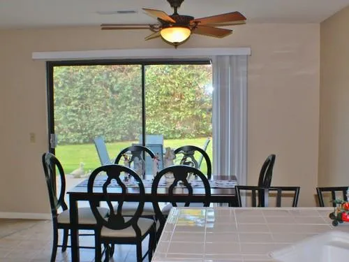 a view of a dining room with furniture window and outside view