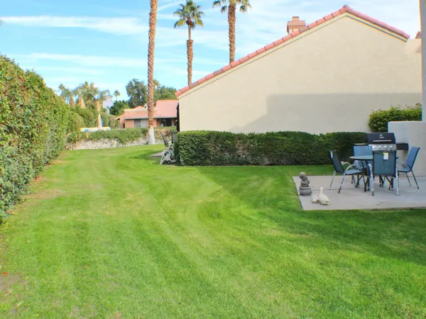 a view of a garden with a sitting area