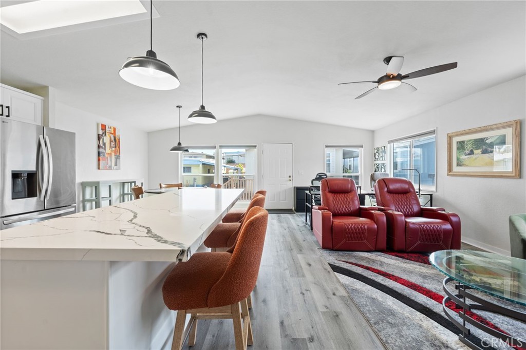 65 Hummingbird Lane Oceanside, CA 92057 - Photo 17 of 38 a living room with furniture a flat screen tv and a window