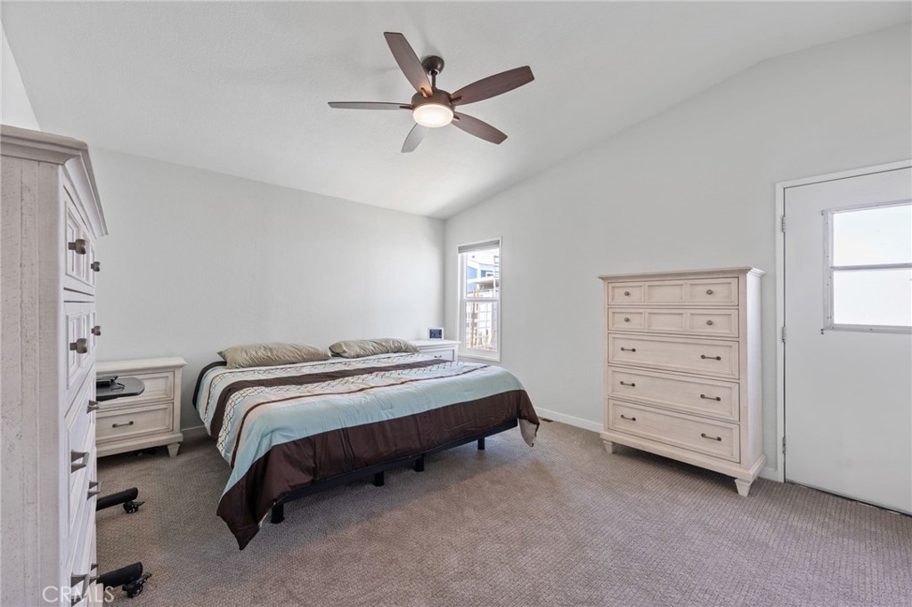 65 Hummingbird Lane Oceanside, CA 92057 - Photo 18 of 38 a bedroom with a bed and a ceiling fan