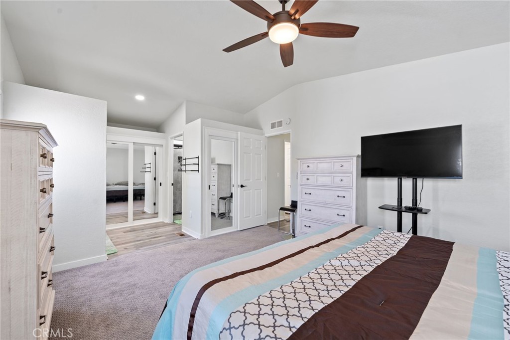 65 Hummingbird Lane Oceanside, CA 92057 - Photo 20 of 38 a bed room with a bed and a flat screen tv