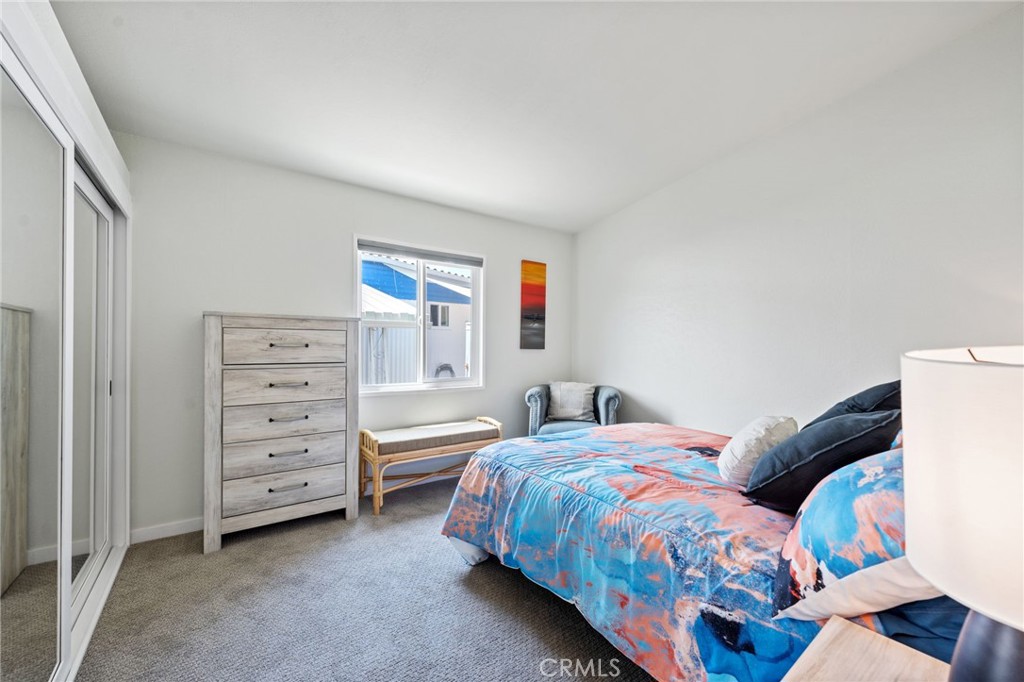 65 Hummingbird Lane Oceanside, CA 92057 - Photo 25 of 38 a bedroom with a bed and a cabinets