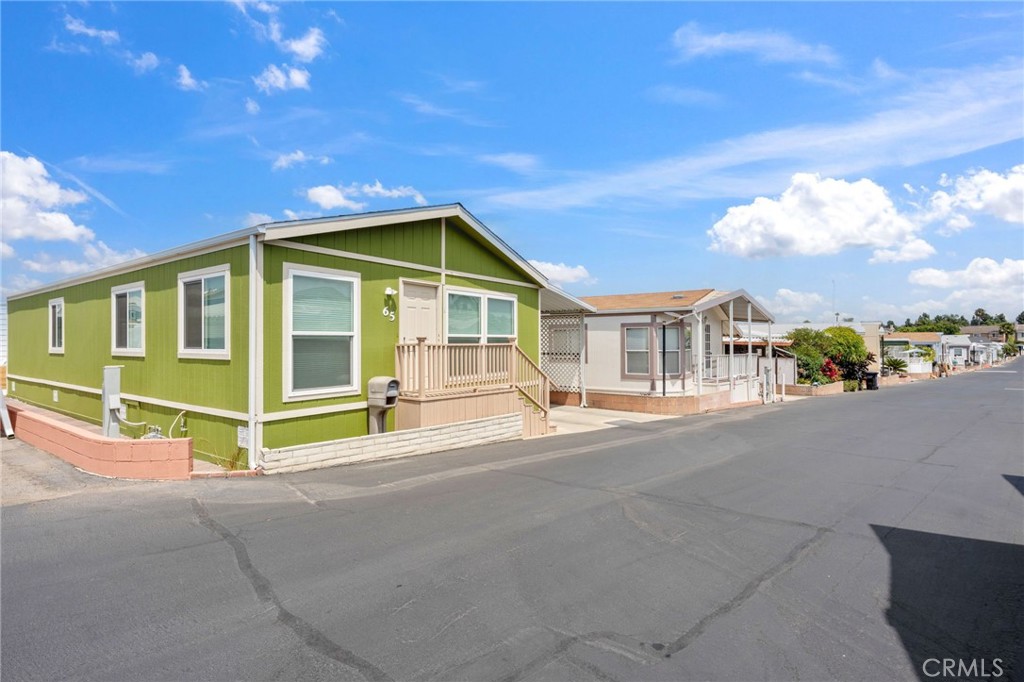 65 Hummingbird Lane Oceanside, CA 92057 - Photo 32 of 38 a view of a house with a outdoor space