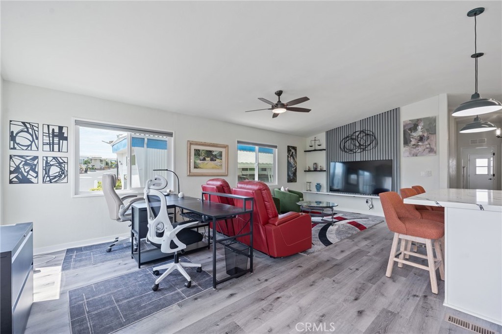 65 Hummingbird Lane Oceanside, CA 92057 - Photo 6 of 38 a living room with fireplace furniture and a wooden floor