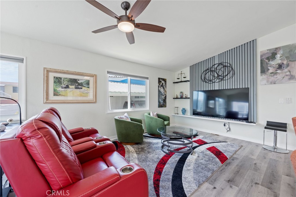 65 Hummingbird Lane Oceanside, CA 92057 - Photo 7 of 38 a living room with furniture and a flat screen tv