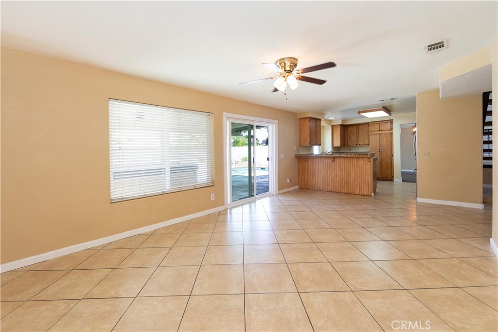 39203 Laurel Leaf Drive Murrieta, CA 92563 - Photo 17 of 59 a view of an empty room with a kitchen