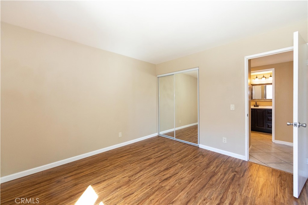 39203 Laurel Leaf Drive Murrieta, CA 92563 - Photo 21 of 59 a view of an empty room with wooden floor