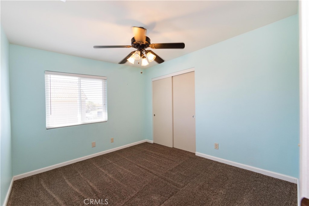 39203 Laurel Leaf Drive Murrieta, CA 92563 - Photo 29 of 59 a view of a room with a ceiling fan and window