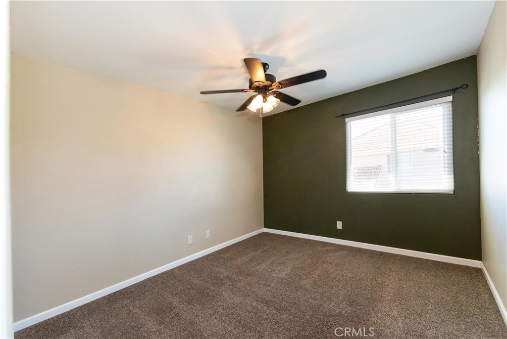 39203 Laurel Leaf Drive Murrieta, CA 92563 - Photo 32 of 59 an empty room with windows and fan