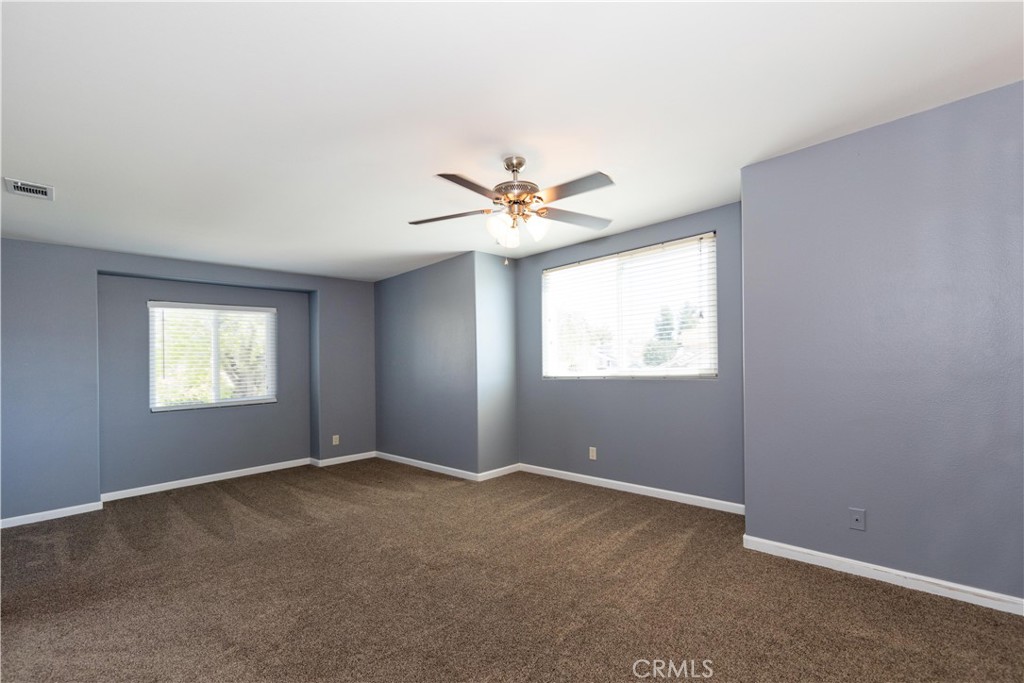 39203 Laurel Leaf Drive Murrieta, CA 92563 - Photo 35 of 59 an empty room with windows and fan