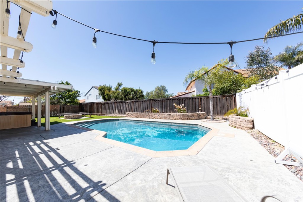 39203 Laurel Leaf Drive Murrieta, CA 92563 - Photo 38 of 59 a view of a swimming pool with a patio