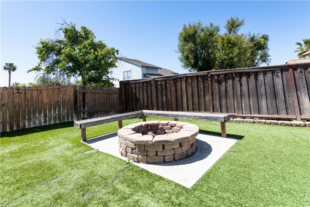 39203 Laurel Leaf Drive Murrieta, CA 92563 - Photo 41 of 59 a view of a backyard with swimming pool and a garden