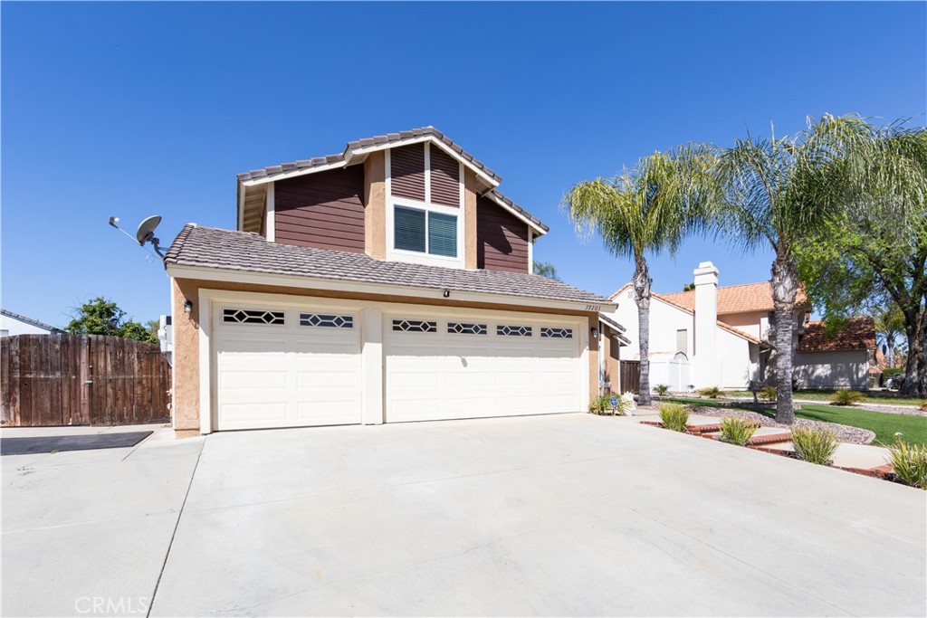 39203 Laurel Leaf Drive Murrieta, CA 92563 - Photo 47 of 59 a front view of a house with a yard and garage