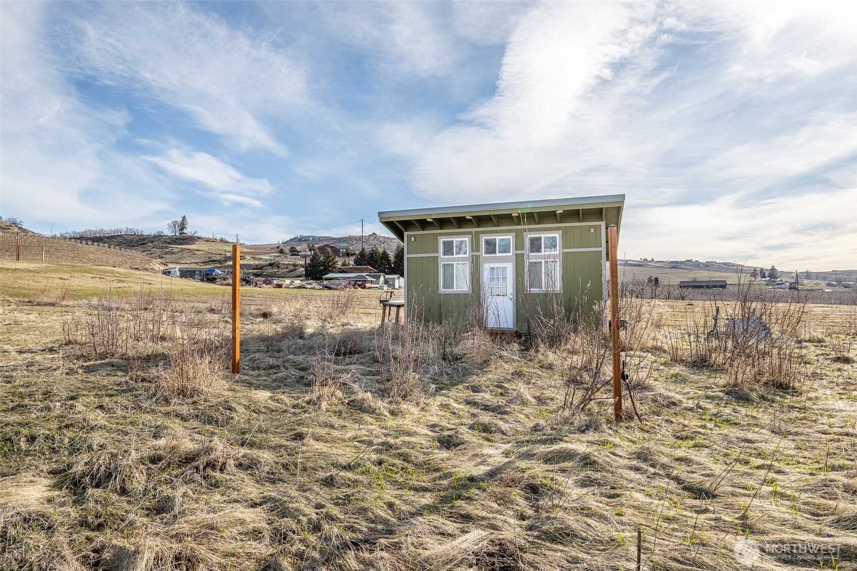127 Hurley Lane Manson, WA 98831 - Photo 13 of 29 a view of a dry yard with wooden fence