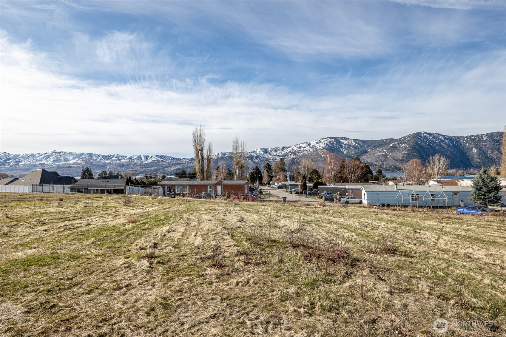 127 Hurley Lane Manson, WA 98831 - Photo 14 of 29 a view of a lake with a city